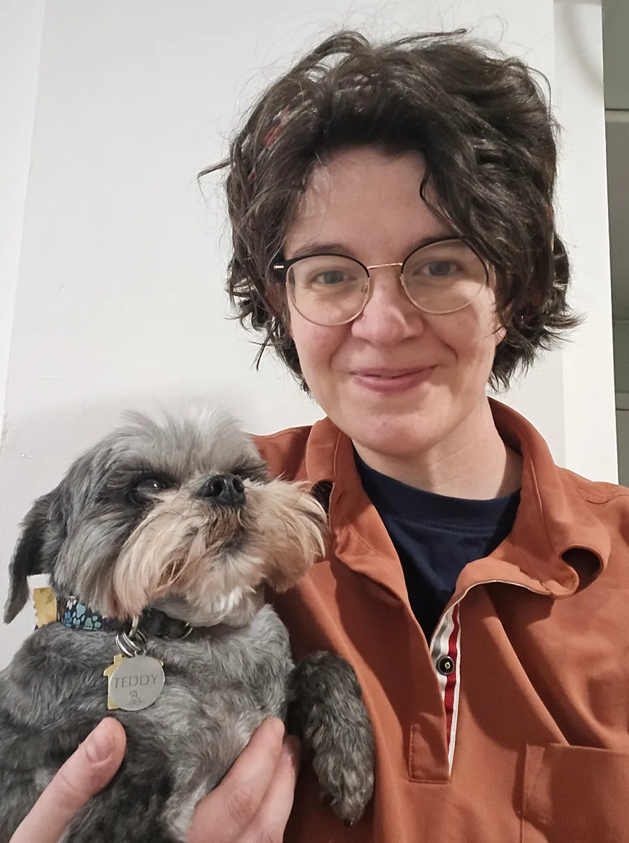 Dr Miriam Main, founder and lead vet, holding her dog Teddy